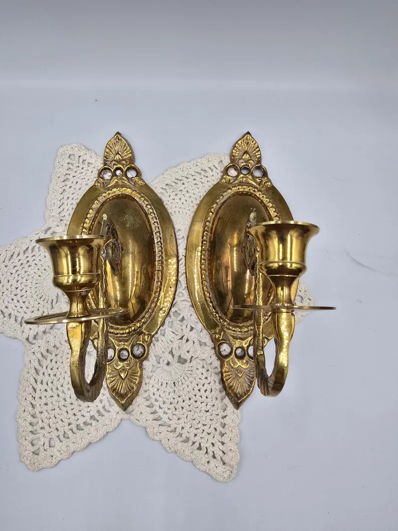 pair of vintage brass wall sconces with ornate backplates and candlestick holders. | Etsy (Global)