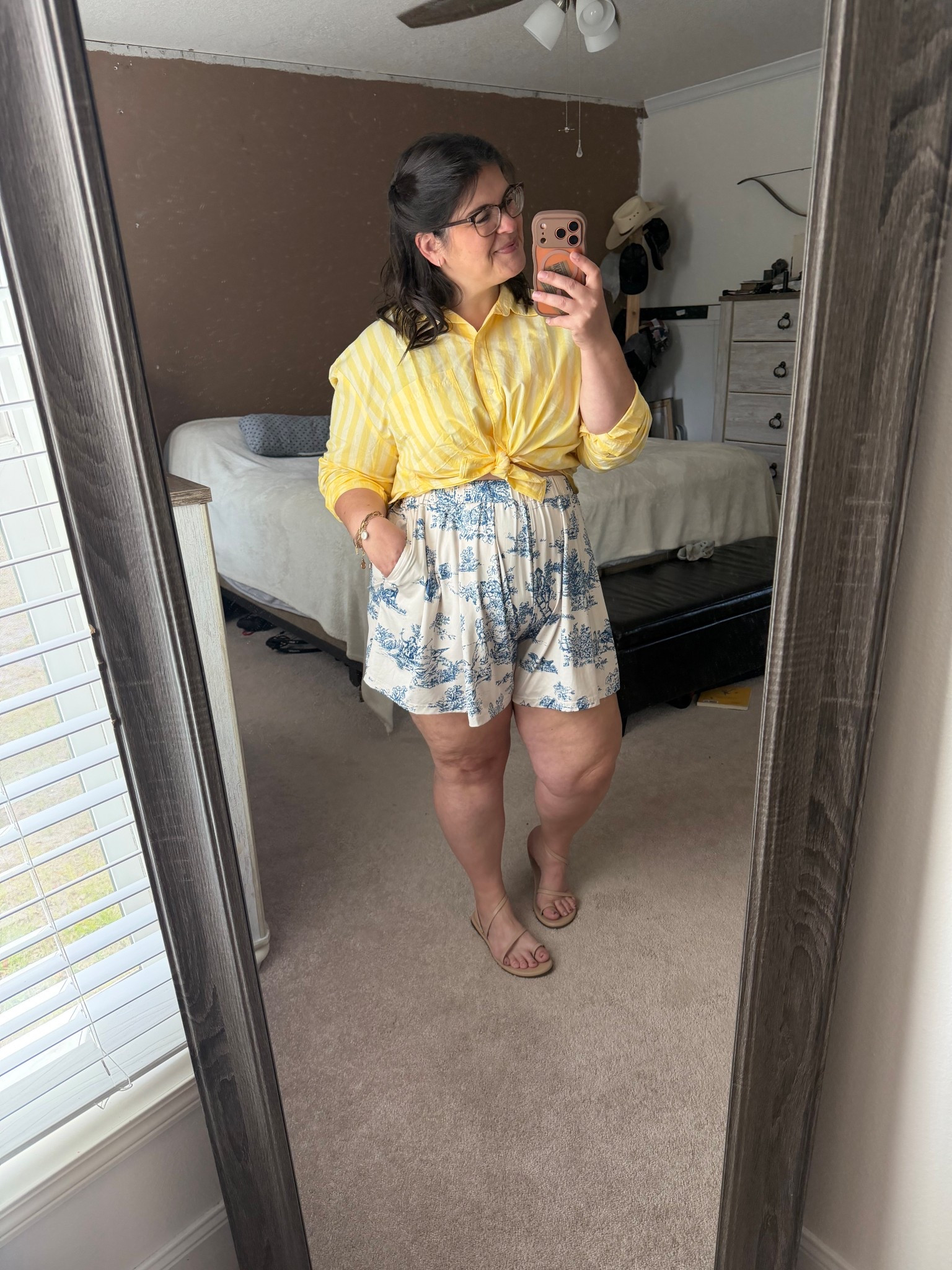 Sunshine outfit but make it comfy ☀️💛
This is one of those “looks put together, feels like pajamas” combos and I’m not mad about it.

Lightweight button-up (tied because we love options), flowy printed shorts with pockets (!!), and easy sandals = Florida-approved uniform.

Perfect for school runs, errands, or just pretending you have your life together while grabbing coffee 😌

#LTKootd #LTKMidsize