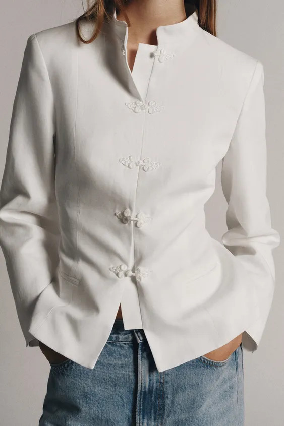 ZARA WOMAN COLLECTIONBlazer made from a 21% linen yarn blend. High collar and long sleeves. A-lin... | Zara UK