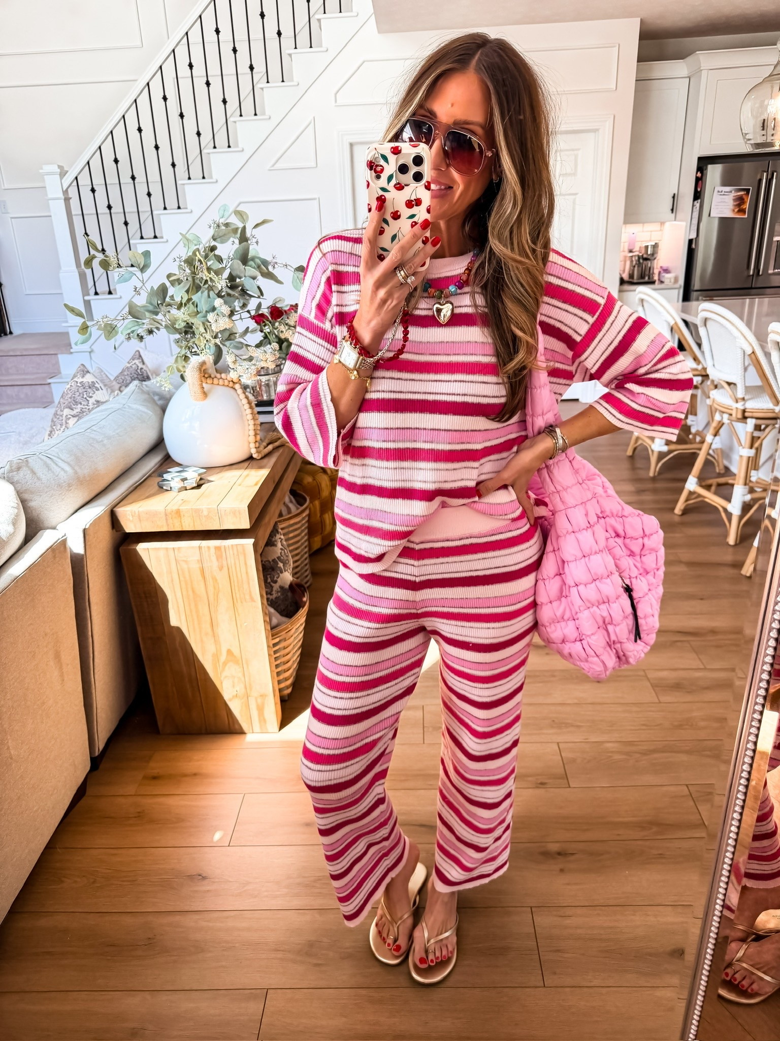This pink striped lounge set is the ultimate combo of comfort and style for your everyday looks. The matching top and pants are perfect for running errands, relaxing at home, or casual weekend outings. Pair with neutral sandals and a fun bag for an effortless, polished look that’s cozy and chic all day.

pink striped lounge set, matching top and pants, cozy summer outfit, casual weekend style, neutral sandals outfit, comfortable chic look, everyday outfit inspiration, fun bag accessory, themominstyle

#LTKSeasonal #LTKootd #LTKOver40