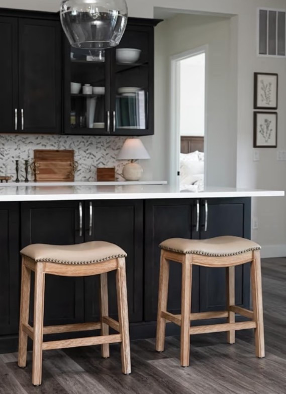 Modern country farmhouse counter stools with that warm rustic charm that instantly makes a kitchen island feel more finished and inviting. 🌿 Perfect for a farmhouse kitchen, modern country home, breakfast bar, dining nook, or open-concept space when you want seating that feels classic, cozy, and elevated. The brown solid wood frame, beige faux leather seat, and backless saddle shape keep the look clean while still adding texture and warmth. 

Add this set of four if your kitchen island needs comfortable everyday seating with timeless farmhouse character. ✨

#LTKHome #LTKfoodie #LTKOver40