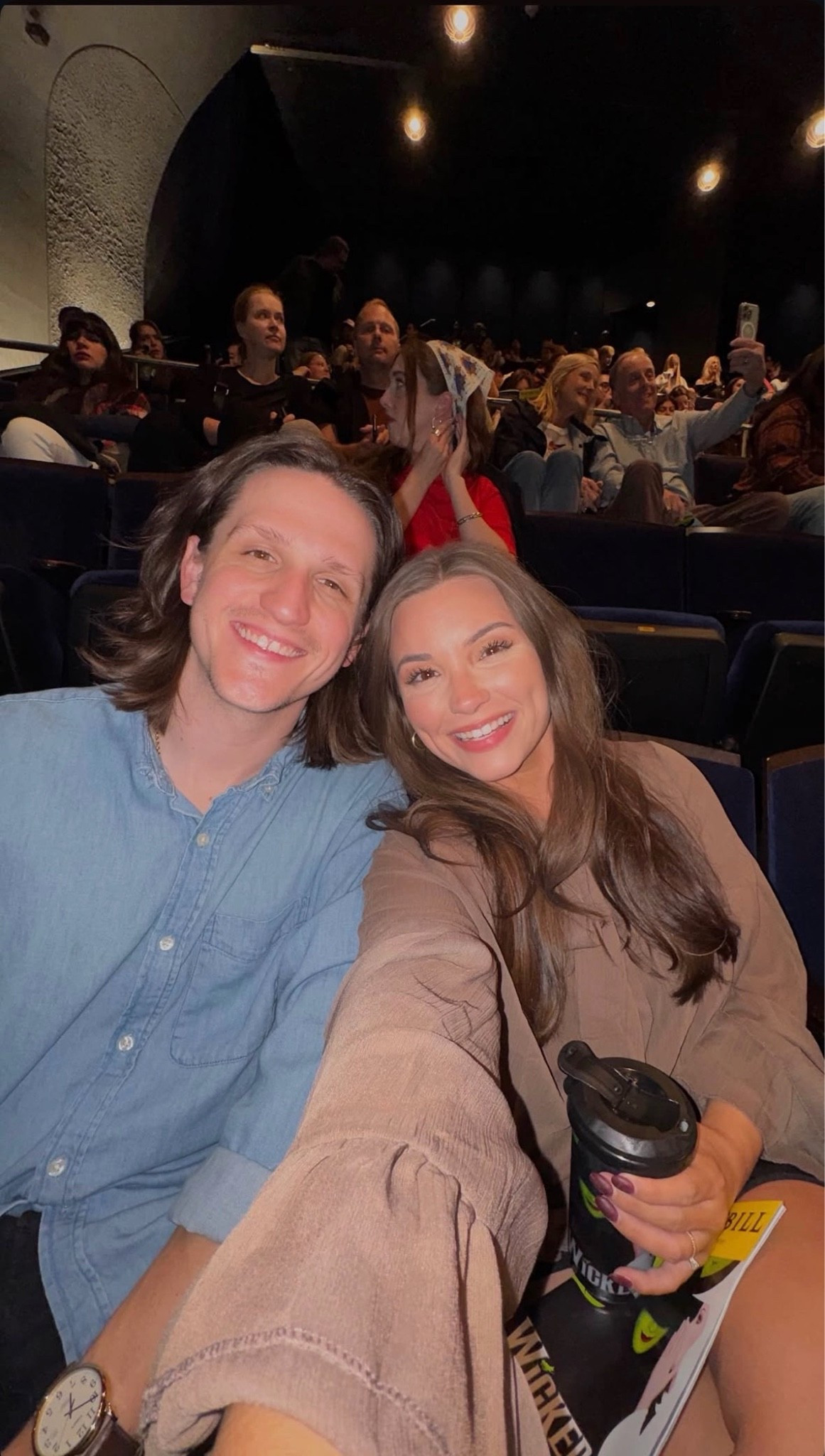 Broadway date night to see Wicked in New York! 🚕♥️✨Loving this brown ruffled sheer top from Amazon. I paired it with tall black boots and a black skirt!