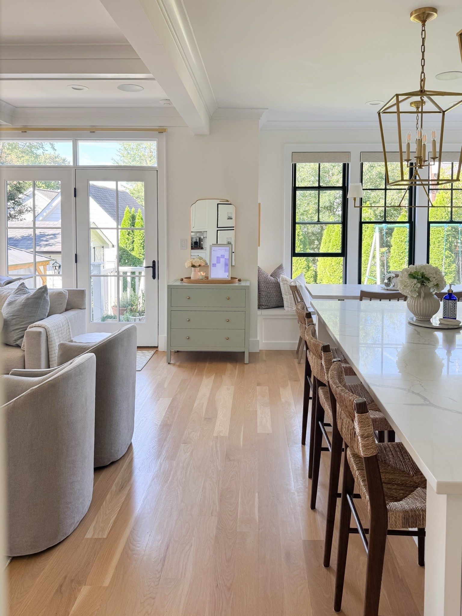 One of my favorite views in our home 🤍 I love how the kitchen, breakfast nook and dining room all flow together while still feeling layered and collected. The soft sage green server chest has been such a good addition—adding a subtle hint of color, extra storage for linens and serving pieces, and the perfect spot for fresh flowers. Timeless, functional, and just a little Nancy Meyers.

#LTKHome #LTKSaleAlert #LTKmomlife