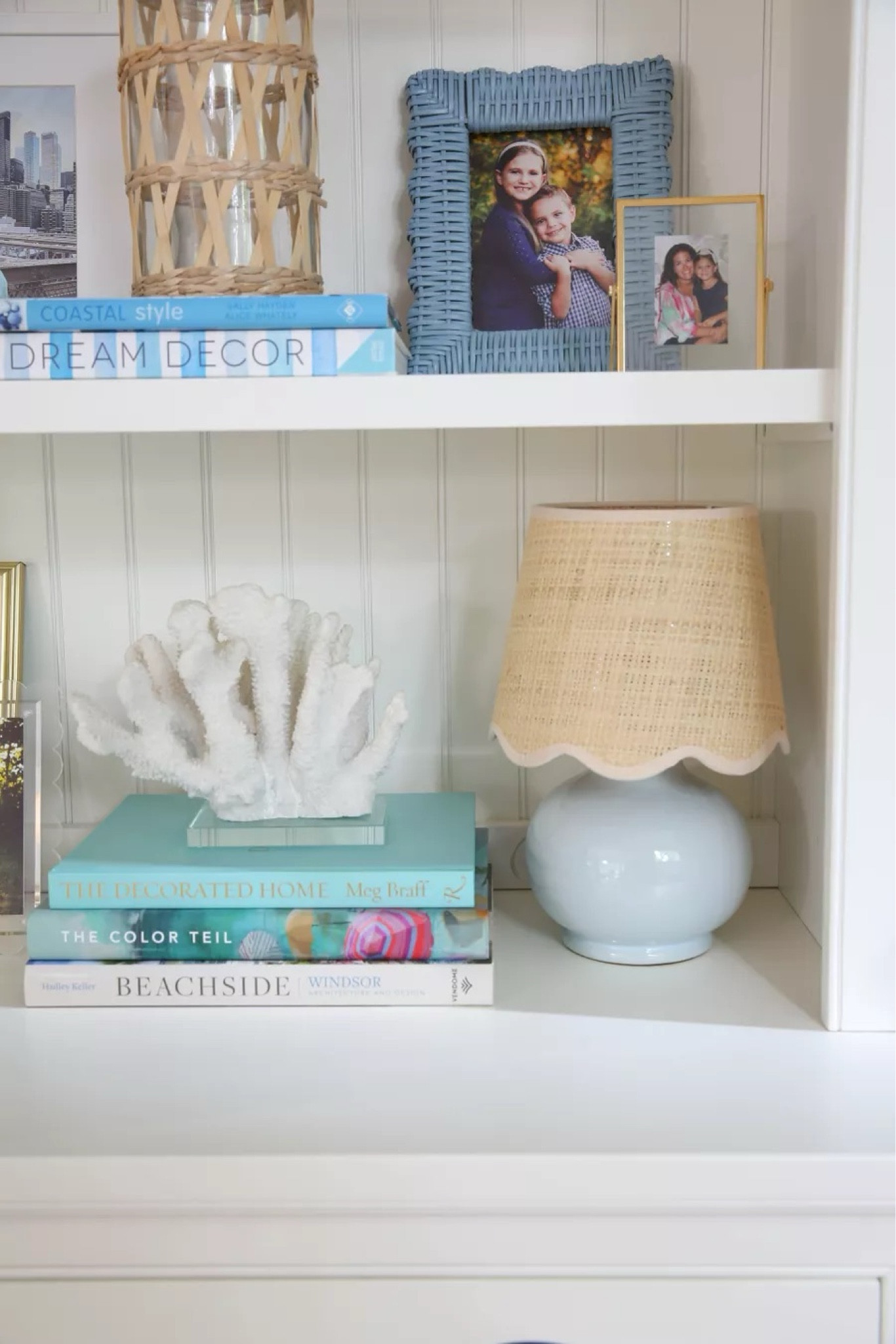 Take your shelf styling up a notch with these coastal ideas! Includes coffee table books, blue lamp, scalloped lamp shade, coral, wicker frames
11/9

#LTKStyleTip #LTKHome