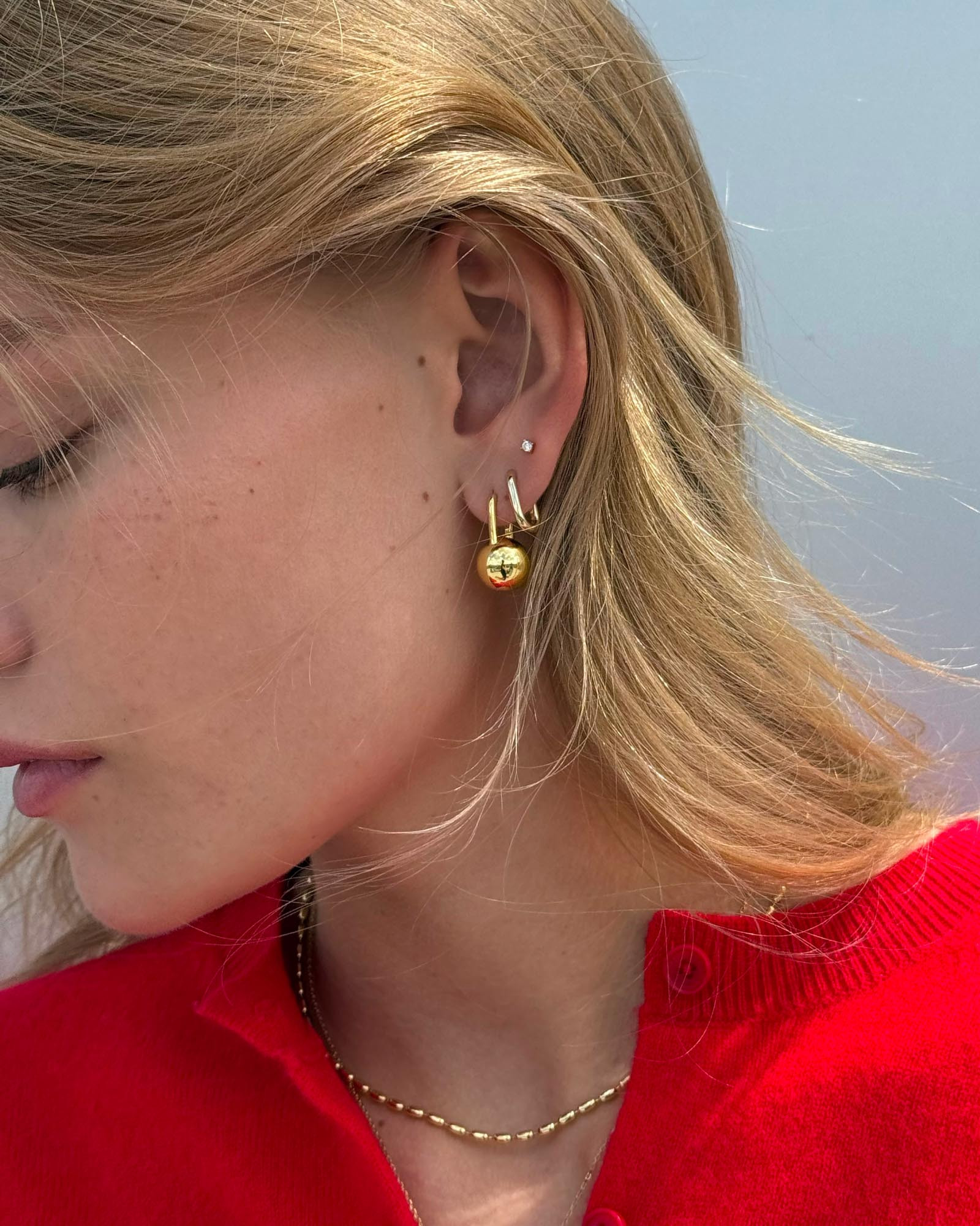 Bold and beautiful, these statement earrings plated in 14k gold feature unique sphere-shaped deta... | Ana Luisa