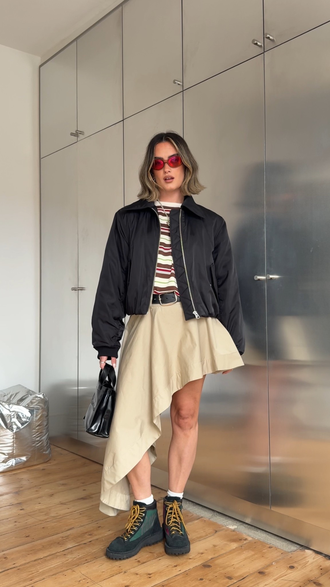 Asymmetric skirt, beige skirt, bomber jacket, black boots, stripe tshirt 

#LTKspring #LTKuk #LTKeurope
