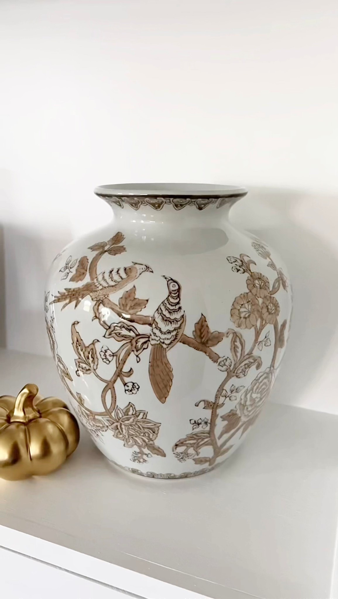 This brown and white chinoiserie vase was the perfect find 🤎

#LTKHome #LTKSeasonal