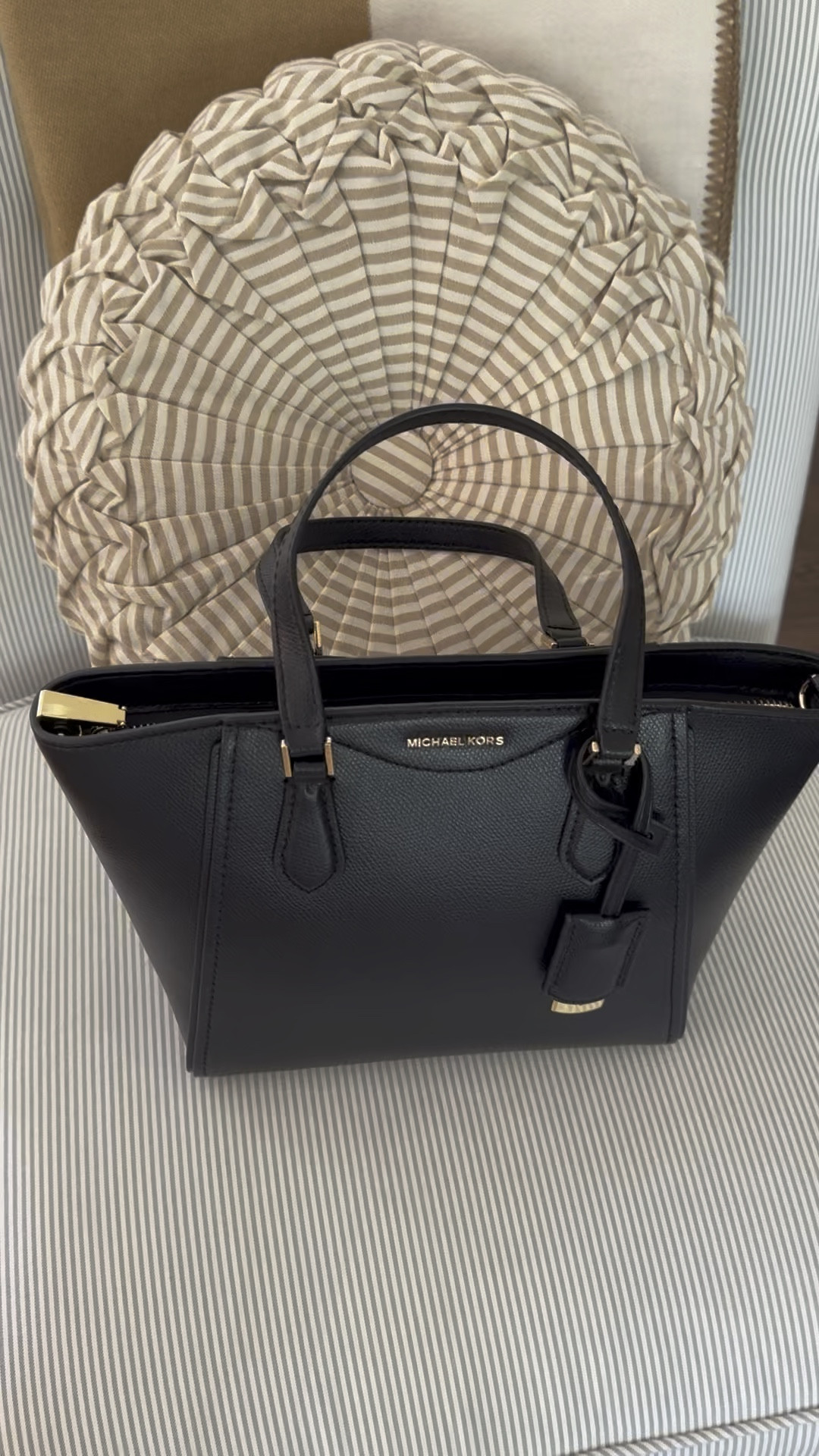 Fall is here with Michael Kors new arrivals at Dillard’s! This is the perfect little black bag! It has an outside pocket and can easily go from day to night with straps for a crossbody option. 
@michaelkors @dillards #mkpartner 

#LTKVideo #LTKItBag
