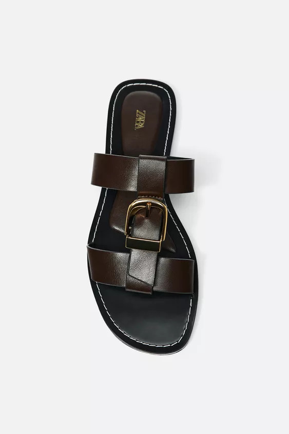 Flat sandals. Double strap with metal buckle at the front. Contrast topstitching detail on the ed... | Zara US