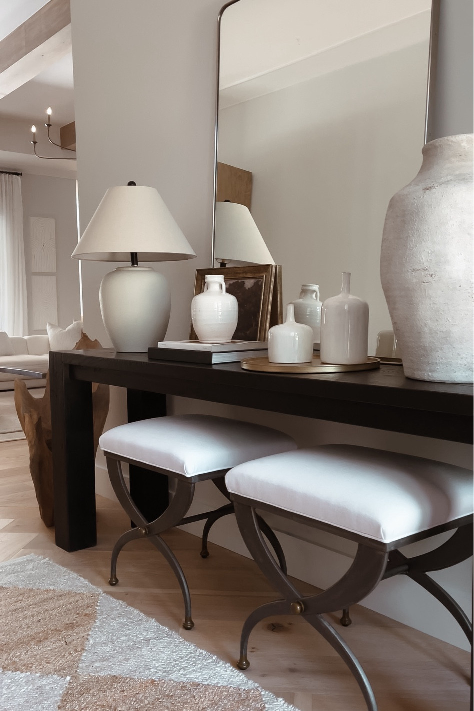 Entryway console styling! 
Lamp, vase, art, tray, ottomans, rug

#LTKhome #LTKstyletip