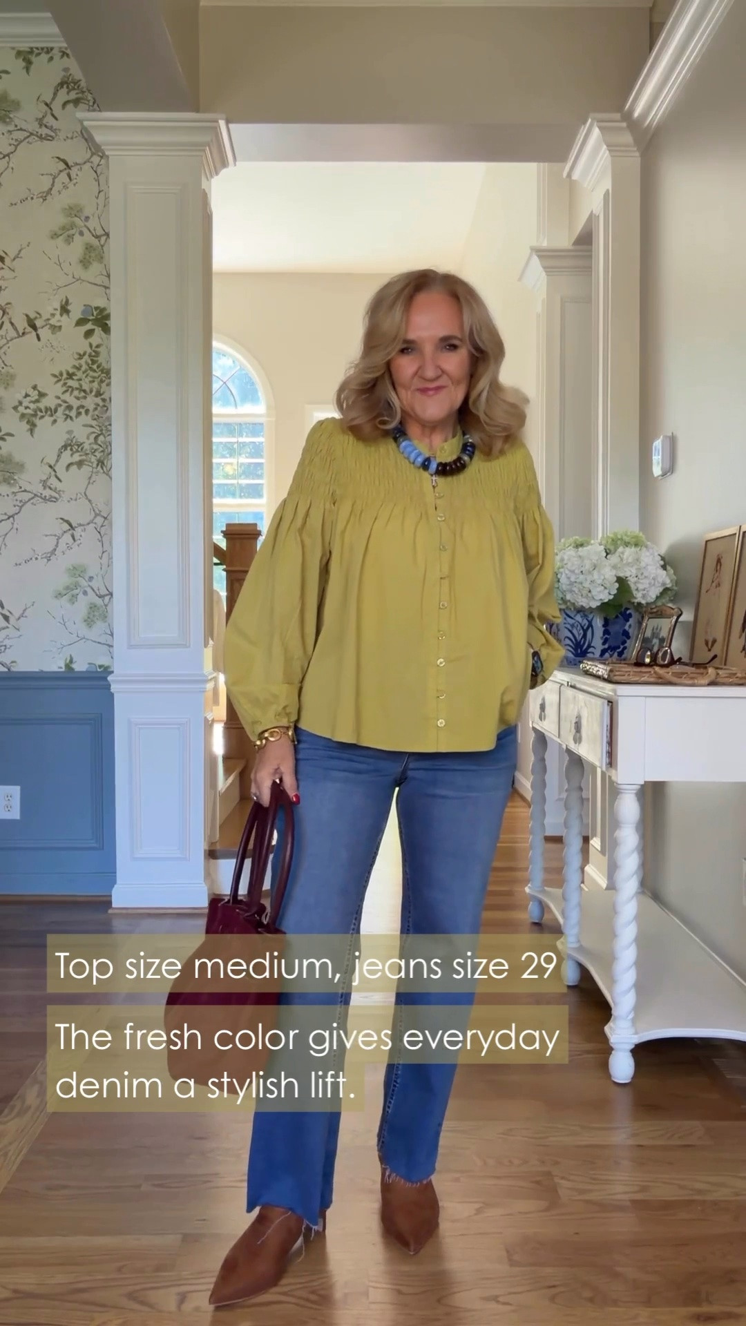 That pretty green is a nice change from all the usual fall colors, isn’t it? I’m wearing a medium in the smocked top and a size 29 in the jeans, and I really like how the blouse falls.