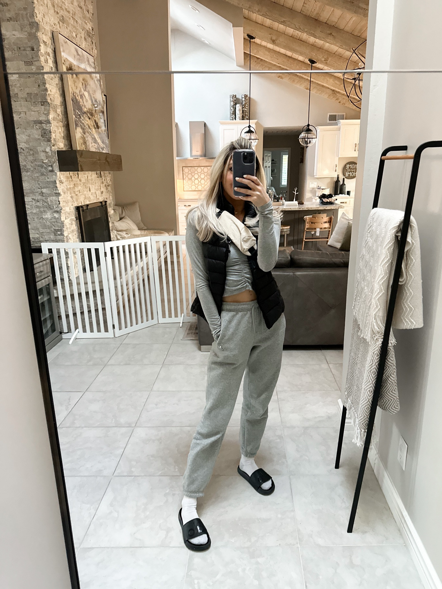 Todays casual fit for running errands! Love these Nike grey high waisted sweatpants (XS). Linking my Amazon crew socks, Alo yoga black slides, similar Amazon black puffer vests and my free people crossbody sling bag 

#LTKunder100 #LTKfit #LTKunder50