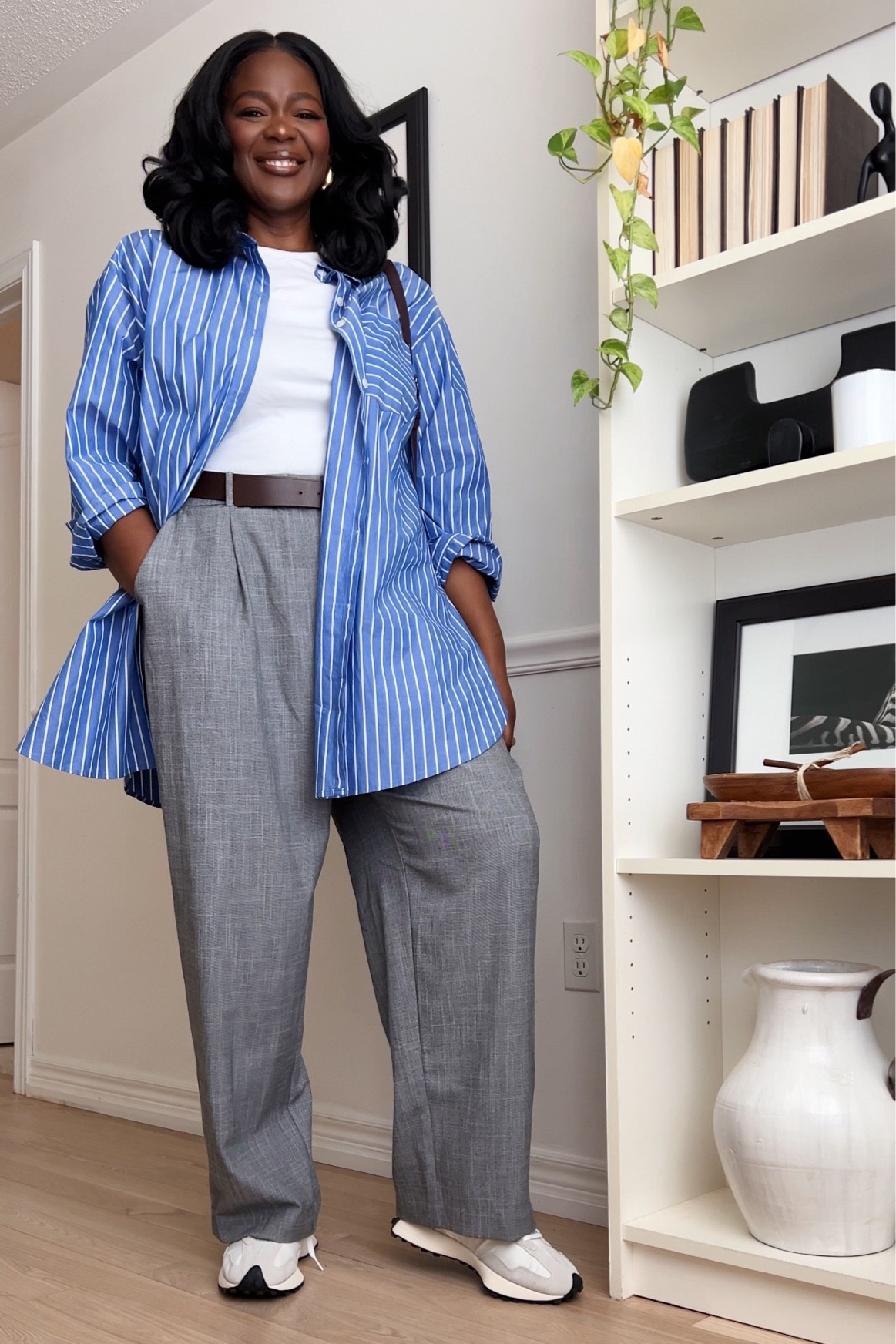 Plus size striped bottom down shirt with white tee and gray pants . Smart casual outfit, new balance outfit, blue shirt, spring outfit, work outfit

#LTKplussize #LTKworkwear

#LTKSeasonal