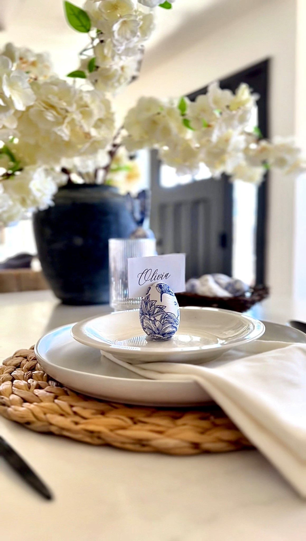 Easter Table setting idea! The egg is a craft egg that I Mod Podged and cut a slit in the top. I added hot glue to the bottom so it can stand 🪺 

🏷️  Easter table setting idea// tablescape // neutral home decor // fluted glasses // cherry blossoms

#LTKFamily #LTKHome #LTKSeasonal