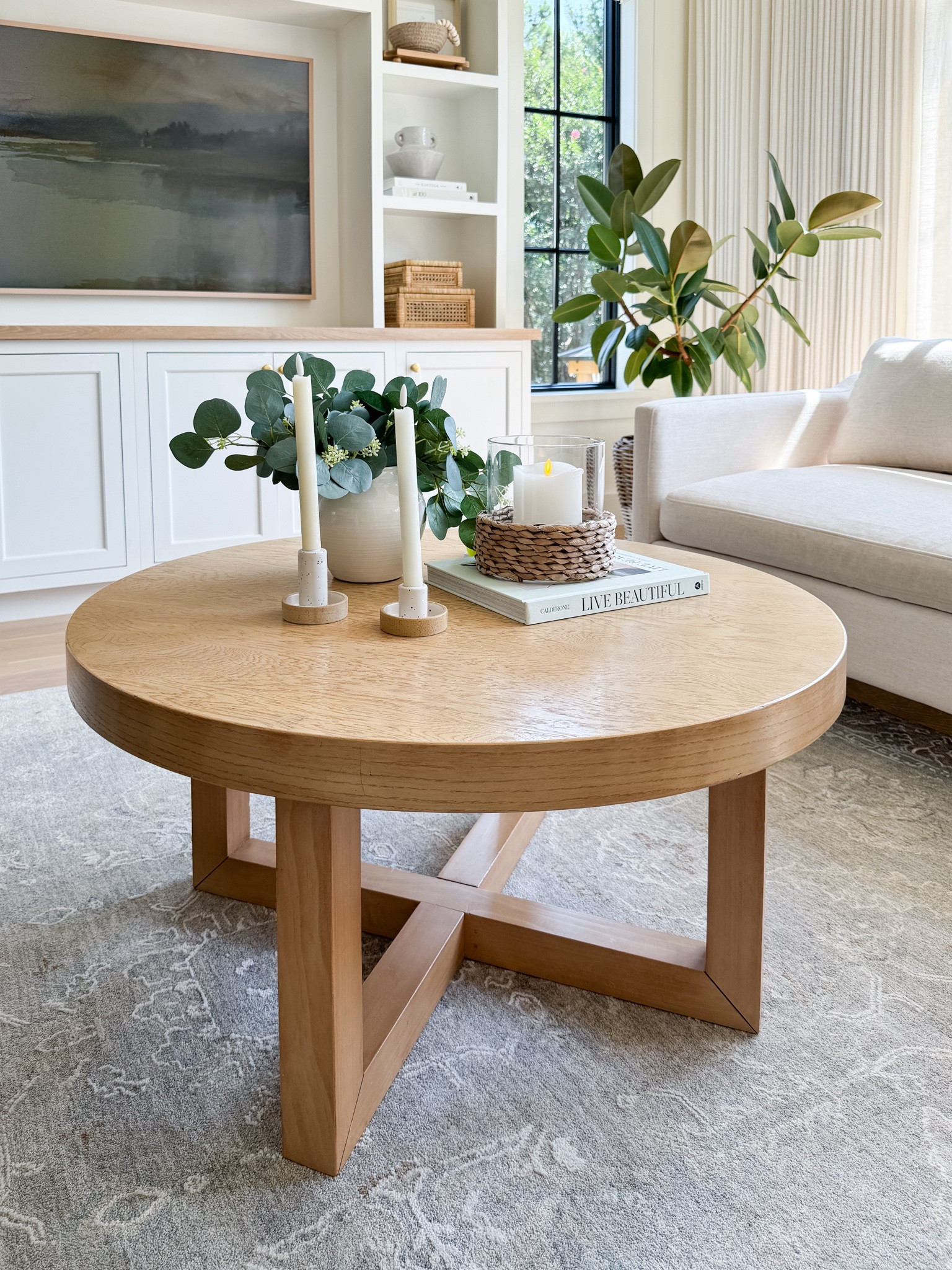 Affordable round coffee table from Target, woven candle hurricane from Walmart, coffee table styling, modern coastal home design 

#LTKStyleTip #LTKSeasonal #LTKHome