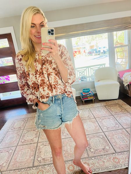 Wearing small in blouse 29 in shorts 