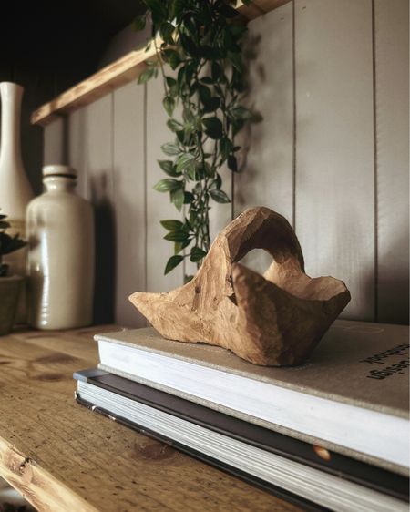A wooden accent piece on your shelves is just asking for attention! Make it an intriguing shape to add instant interest #woodenaccents #hygge #shelfie 

#LTKstyletip #LTKU #LTKhome