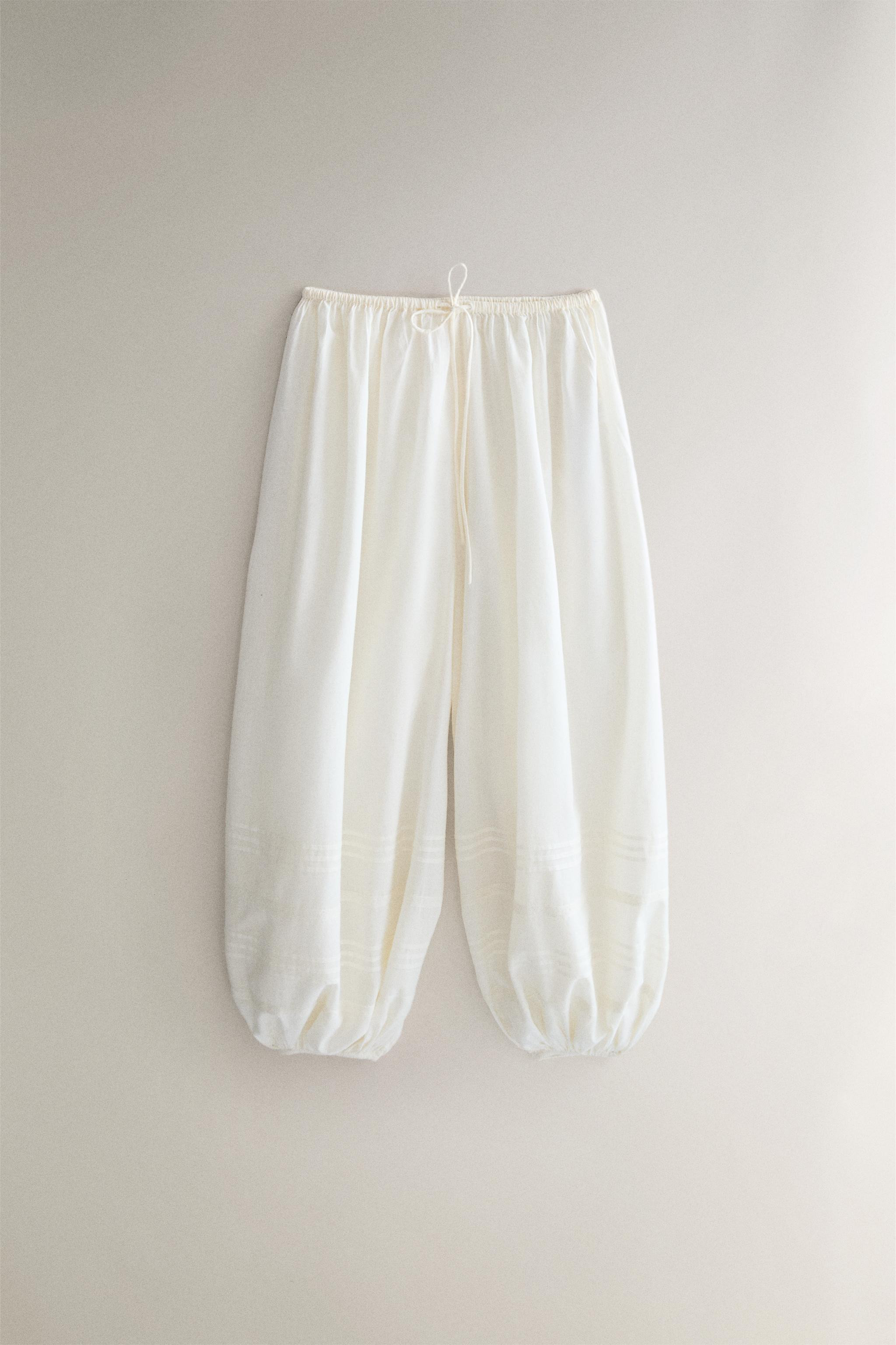 Cotton smocked trousers. Plain design with lace and drawstring details. Elastic waistband and fit... | Zara US