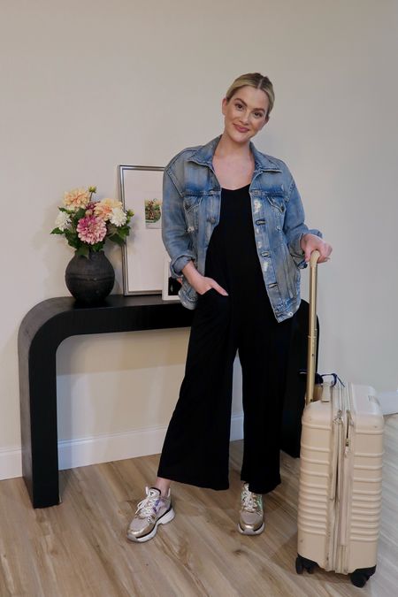 Airport outfit for travel day - nursing friendly soft jumpsuit, chunky comfortable sneakers, carryon roller, and Jean jacket  travel outfit 

#LTKShoeCrush #LTKTravel