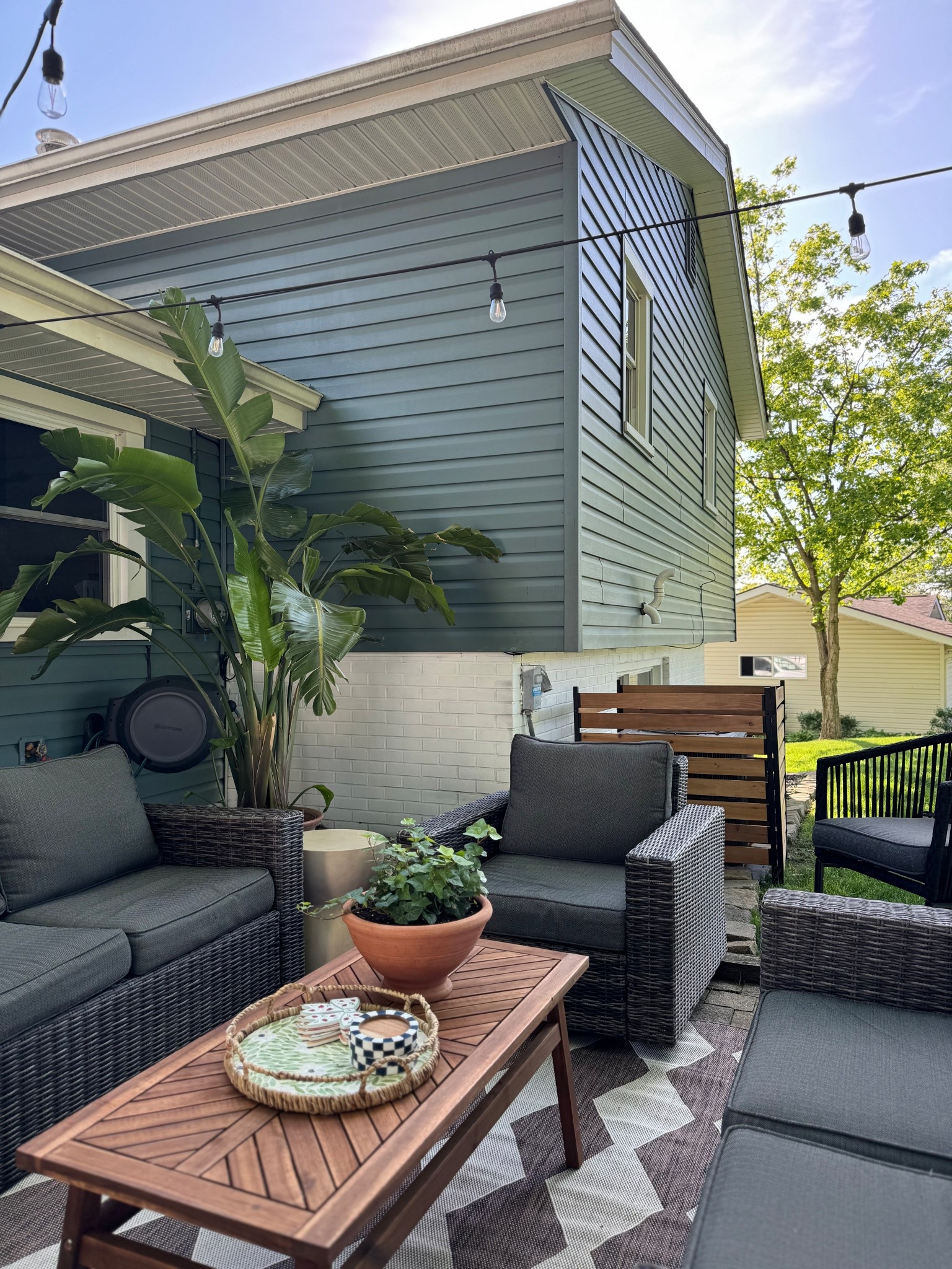 Patio is coming along so well🥰 new rug, table and AC unit border!! Linking it all, patio set is 5 years old and no longer sold but found similar and linked! 

Patio decor, patio table, coffee table 

#LTKHome #LTKSummerEdit #LTKSeasonal