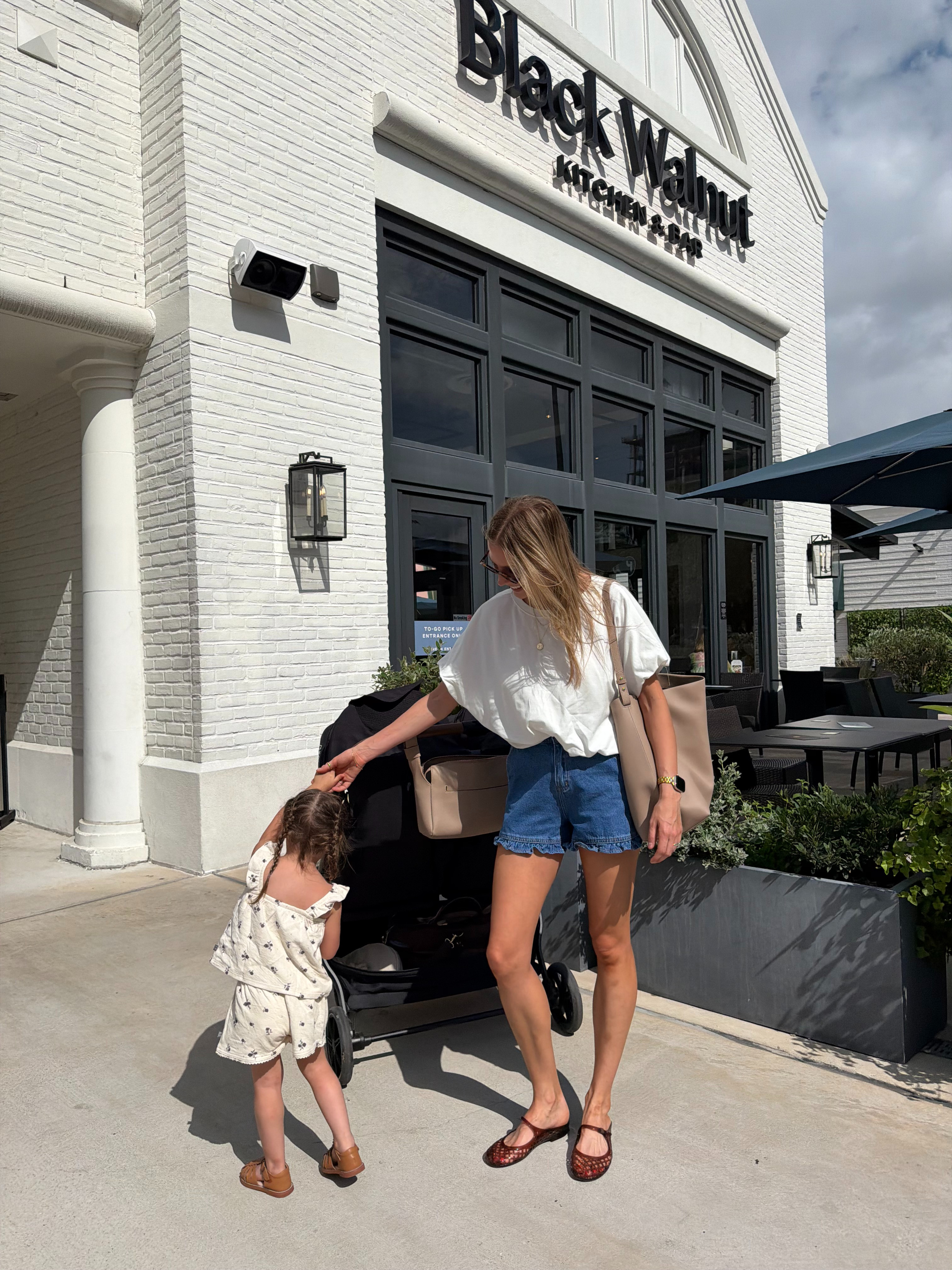 Nursing friendly summer mom outfit | 2 in ruffle denim shorts + M in white bubble tee  

 