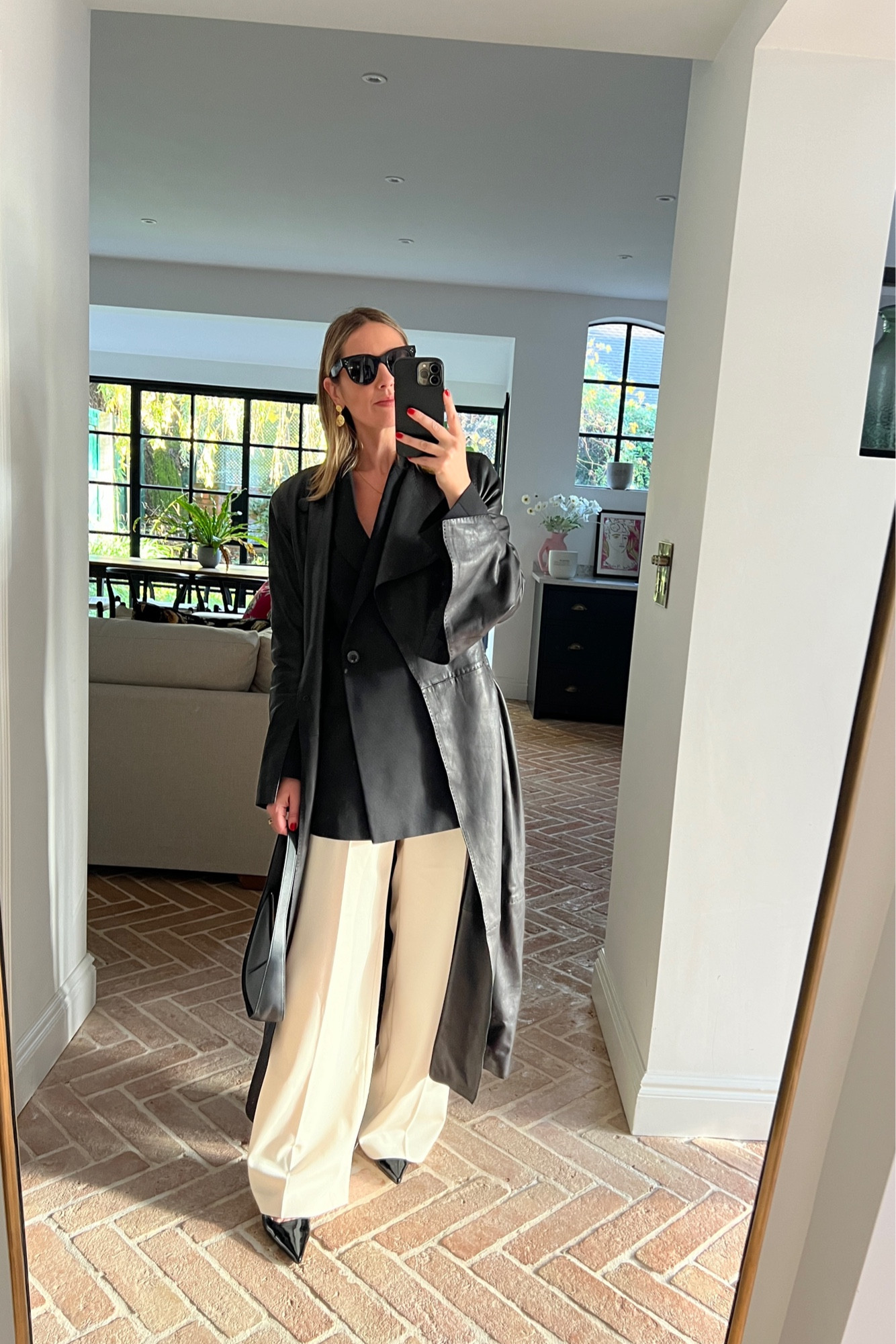 Day 1/7 recreating Pinterest outfits 📌 
Long Leather Coat 
Cream Trousers 
Black Slingbacks
The Row Moon Bag 
Black Blazer 

#LTKworkwear #LTKstyletip #LTKeurope