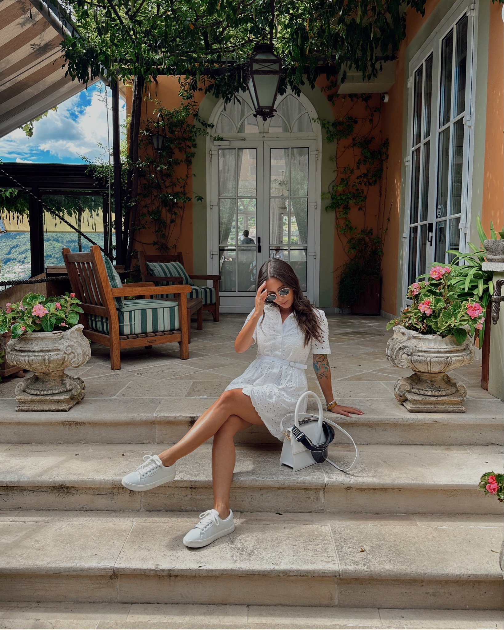 Adventurous day through Ravello in mid-September in this embroidered white cotton dress and white sneakers. I have to say I was so comfortable frolicking through the village and gardens in this outfit. I also sat in a car a lot between driving the Amalfi coast and I felt great the whole time in this little travel outfit for my last honeymoon outfit.

Dress: Zara 
Shoes: Sam Edelman
Bag: Jacquemus 
Visor: Dior
Glasses: Parfois

#LTKTravel #LTKWedding #LTKStyleTip