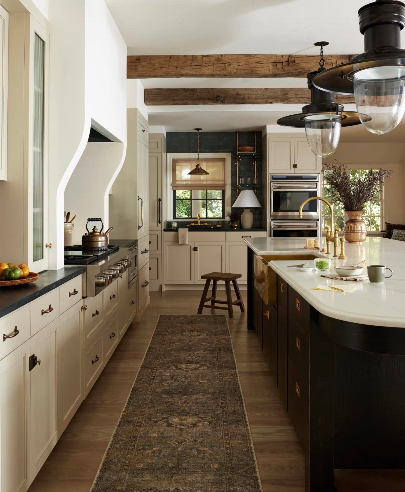 A runner like this instantly warms up a kitchen. The muted pattern and neutral tones bring in just enough texture while still letting the cabinetry and other finishes shine. Perfect for long kitchen islands or other high traffic spaces that need both style and softness. This rug comes in many sizes and would also be great in a moody bedroom or home office. 

kitchen runner, neutral rug, patterned runner, traditional kitchen, warm wood tones, timeless kitchen decor, classic home style, runner rug for kitchen, island runner rug, cozy home details, lived in home, neutral farmhouse style, area rug

#LTKHome