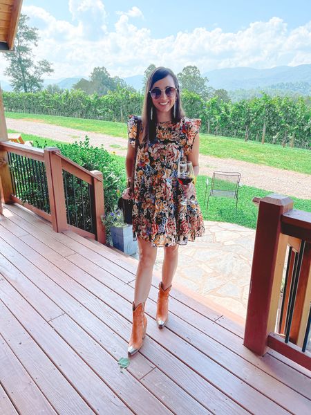 Red dress boutique floral dress, free people Brayden cowgirl boots at a winery
￼




#LTKtravel #LTKstyletip #LTKSeasonal