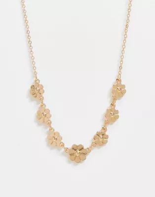 ASOS DESIGN necklace with daisy flowers in gold tone | ASOS (Global)