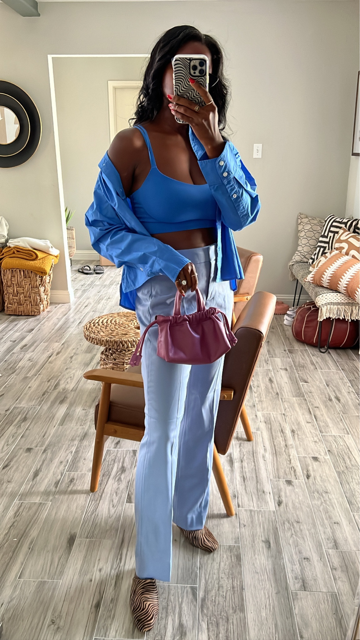 Monochromatic blue outfit! Go from office to happy hour. Blue button down cropped shirt, blue flare trousers, blue strappy sport bra, animal print mules and plum cross body purse  

#LTKworkwear #LTKSeasonal #LTKunder100