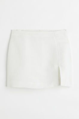 Conscious choice  Short skirt in a woven linen and viscose blend. Regular waist, concealed zipper... | H&M (US + CA)