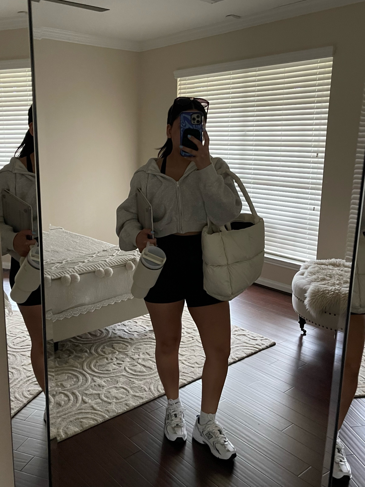 Yoga outfit idea 
Zip hoodie: xs 
Biker shorts: small
New balance 530: 4.5 men 
White ankle socks 
Aviator sunglasses 
Stanley cup 
Puffer tote bag 

#LTKstyletip #LTKSeasonal #LTKfindsunder100