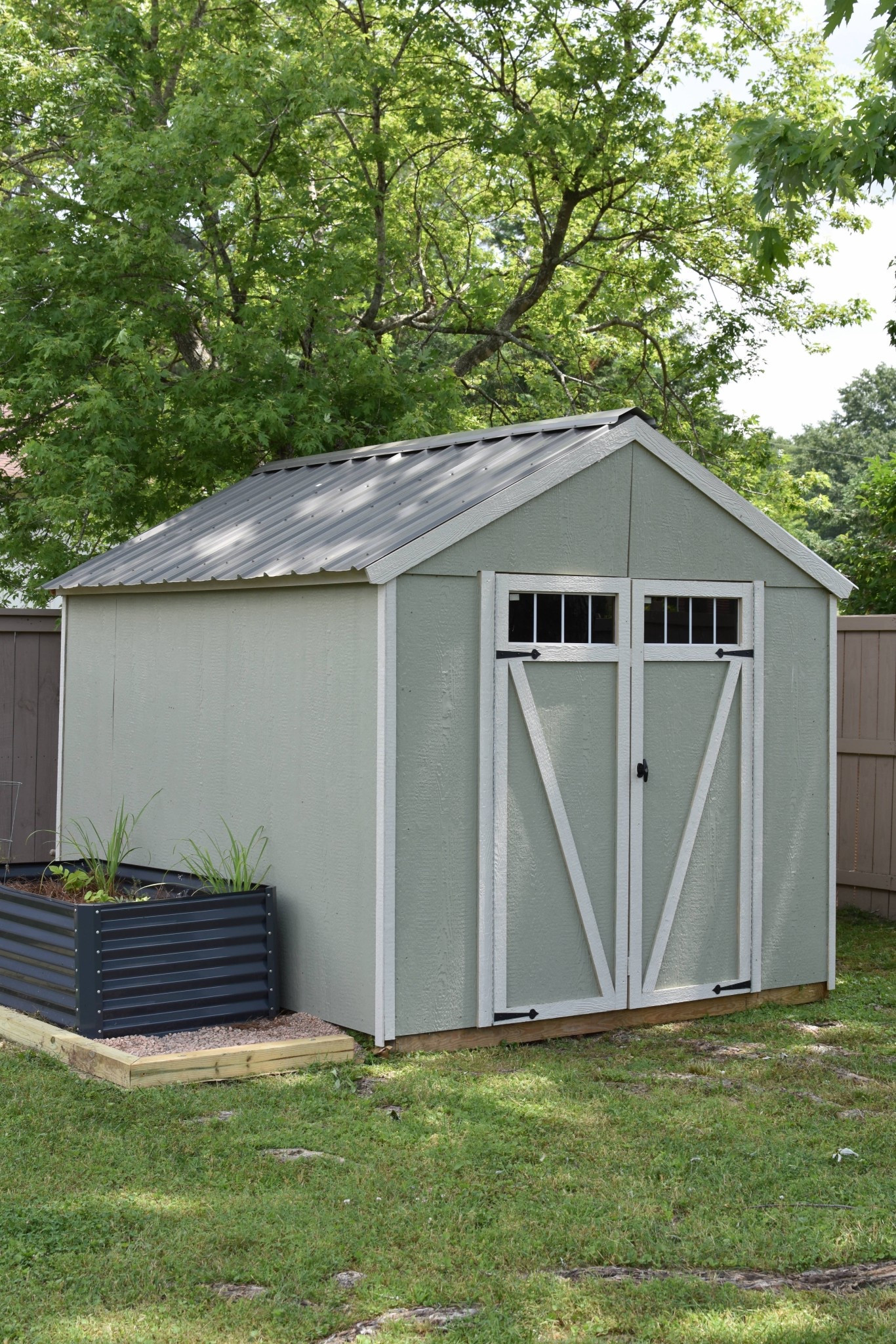 My husband ordered this shed kit from Lowe’s and assembled it himself. It was delivered in pieces on a pallet so he was able to move it into our backyard without removing the gate. We used the floor included version, so all we had to purchase in addition was the metal roof and paint!

#LTKHome #LTKSeasonal