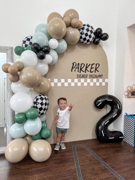 Parker’s TWO fast birthday backdrop! Checker, car birthday party theme. 

***To get the light green color we just stuffed a white balloon into the green balloons and they came out a bit lighter! 🥰👏🏼 

#LTKunder100 #LTKfamily #LTKkids