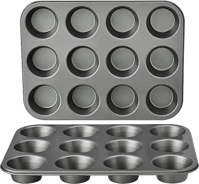 Amazon Basics Nonstick Muffin Pan, Set of 2, Sturdy, Oven Safe, Bakes Evenly, Easy to Clean, 12 C... | Amazon (US)