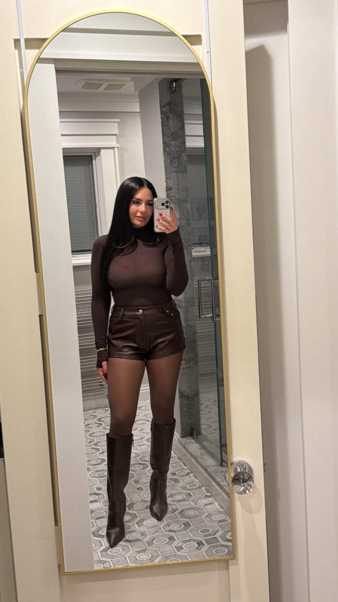 Brown leather hot shorts, brown bodysuit, brown tights, brown boots 

#LTKSeasonal