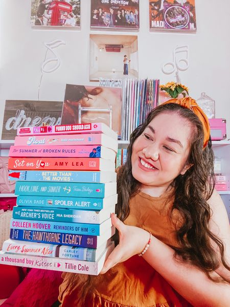 Book Haul Selfie! 📚📷 Here is my latest book haul. 💸 Every month I say I’ll buy only a few books but then I find more I want to buy and then all of a sudden I blink and end up with a stack of new books. 💙 I don’t regret it though. 😂 I’m a sucker for buying new books and it’s been an expensive hobby but makes me so happy. 🥰 I already have a few in my cart that I’m about to buy. 🛒 Do you have a book buying problem too? 🤔