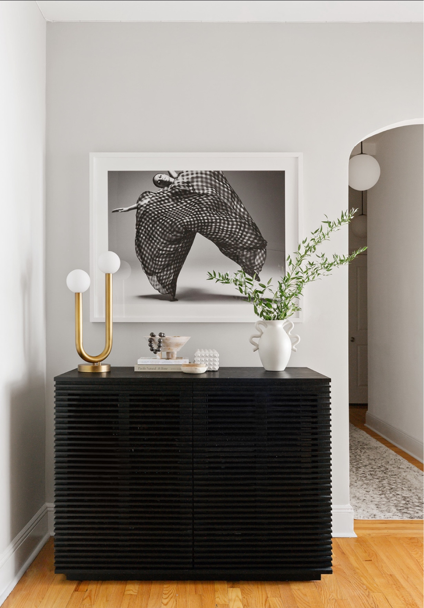Make an impression when your guests make an entrance. Our dramatic ebonized cabinet hides all of the things and of course the brass touches make it super elegant  🤍

#LTKstyletip #LTKhome #LTKGiftGuide