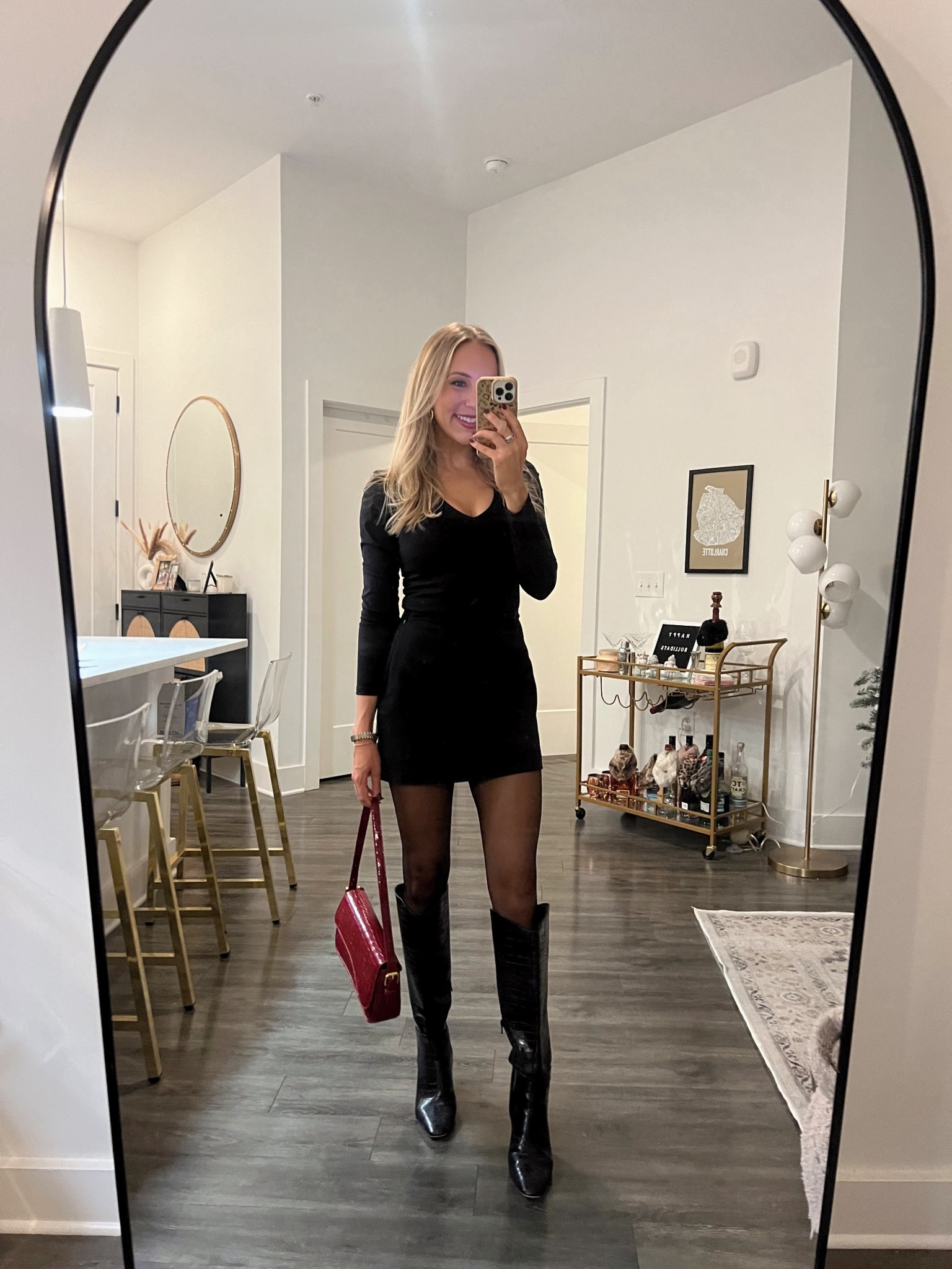 Black mini skort outfit, knee high boots, long sleeve top, burgundy shoulder bag, sheer tights dinner outfit, girls night out outfit, winter date night outfit idea 

#LTKootd #LTKgrwm