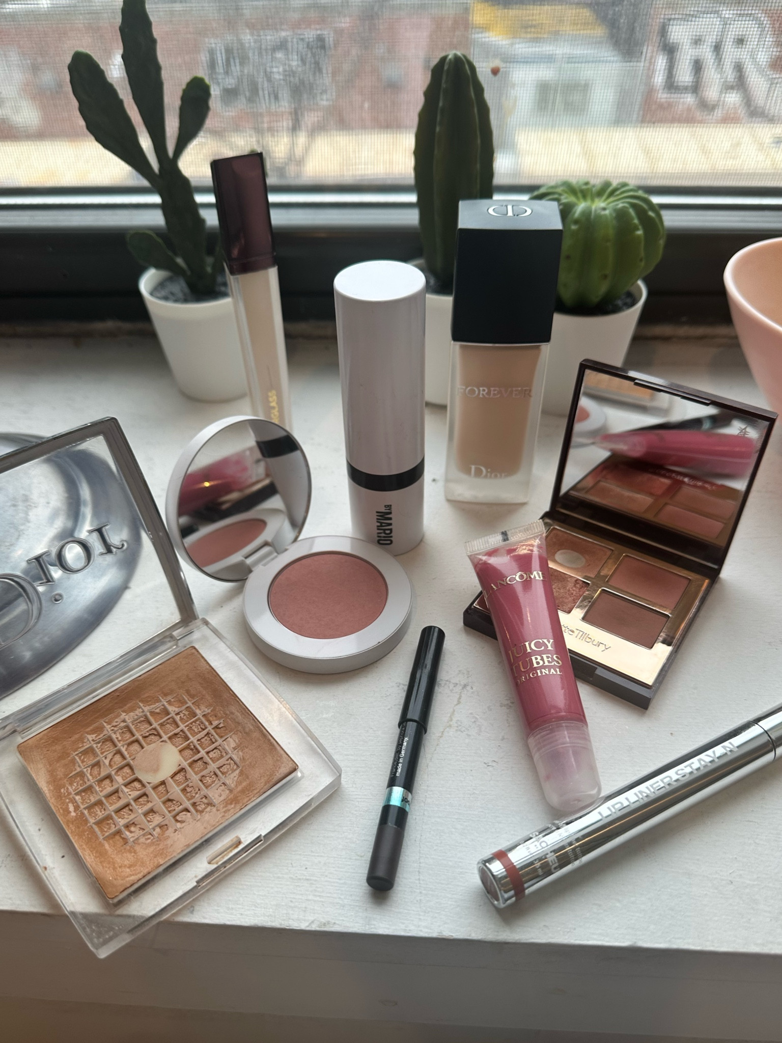 My current and ✨well loved✨ makeup. Obsessed with the Dior forever matte foundation and the hourglass concealer is just perfection 🤌🏻 the Lancôme juicy tube is taking me down memory lane but you guys it is the best of the best. A true classic for a reason 🥰 forgot to take a picture of my favorite tubing mascara but it’s tagged below! 

#LTKbeauty
