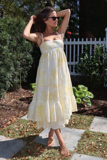 Shop Naomi Olindo's yellow hand painted floral underwire empire waste two tiered ruffle hem dress perfect for best dressed wedding guest spring summer

#LTKwedding #LTKstyletip