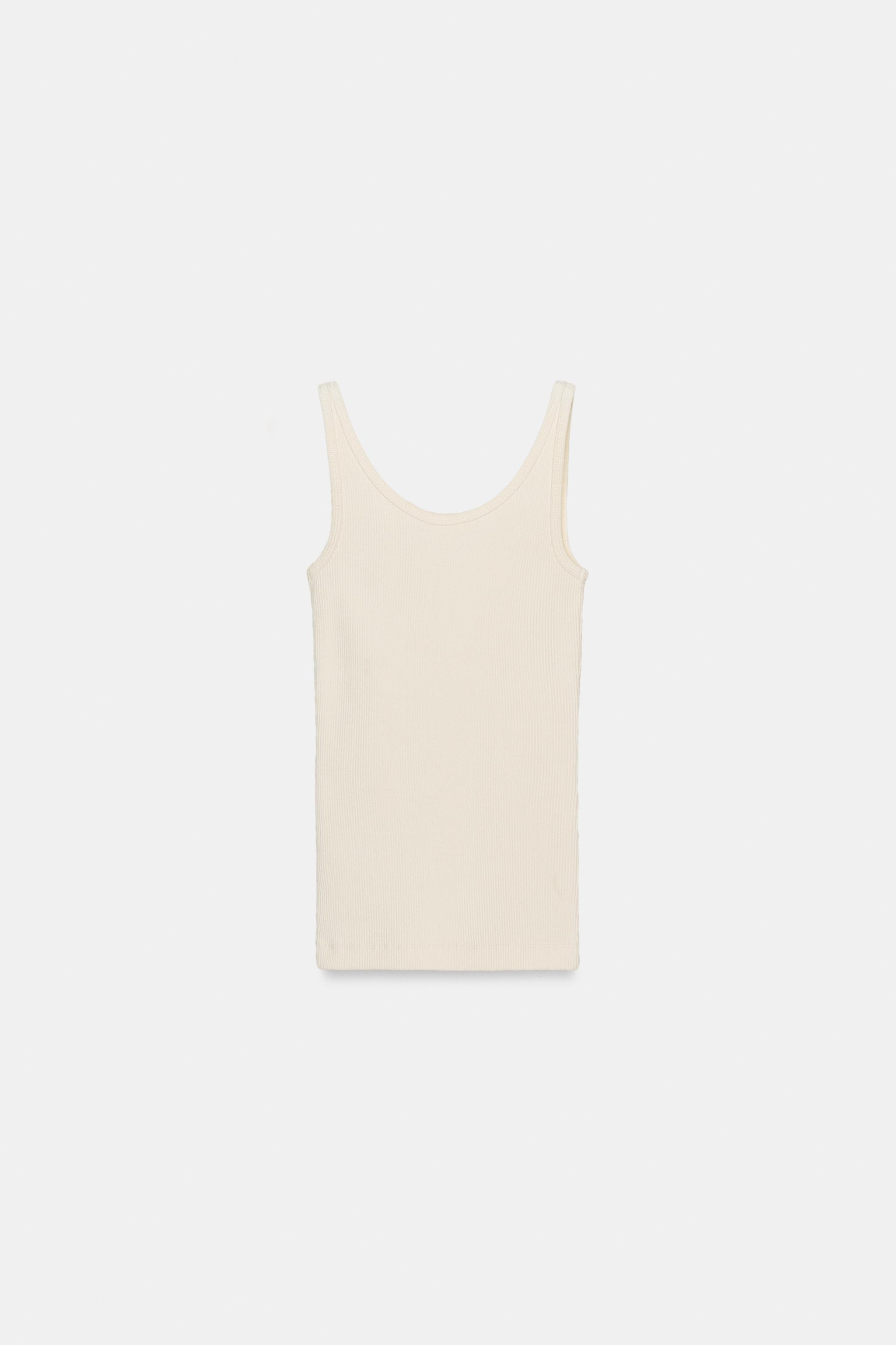 Top made from cotton yarn. Round neckline and spaghetti straps. Ribbed fabric. Straight hem. | Zara US