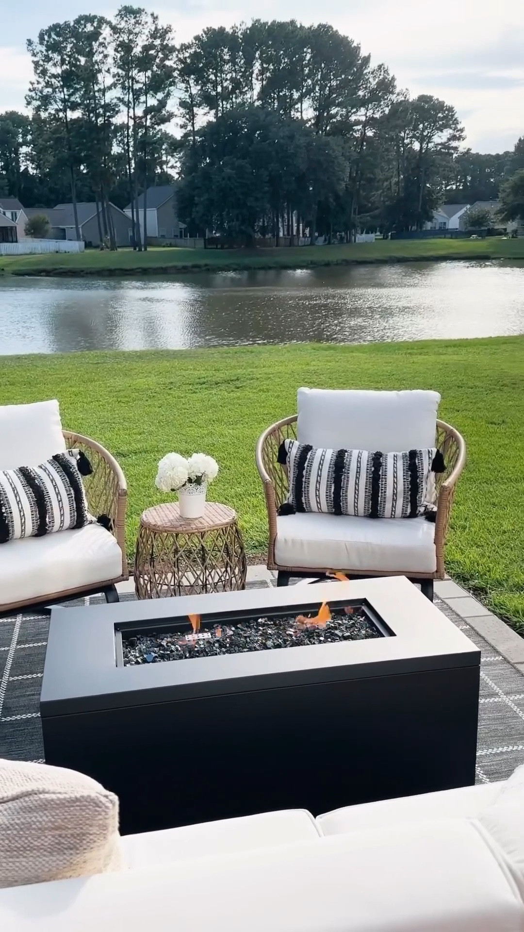 Outdoor living space with a smokeless fire pit, outdoor furniture and decor from Walmart, wicker outdoor chair and table set, throw pillows

#LTKHome #LTKSeasonal #LTKVideo