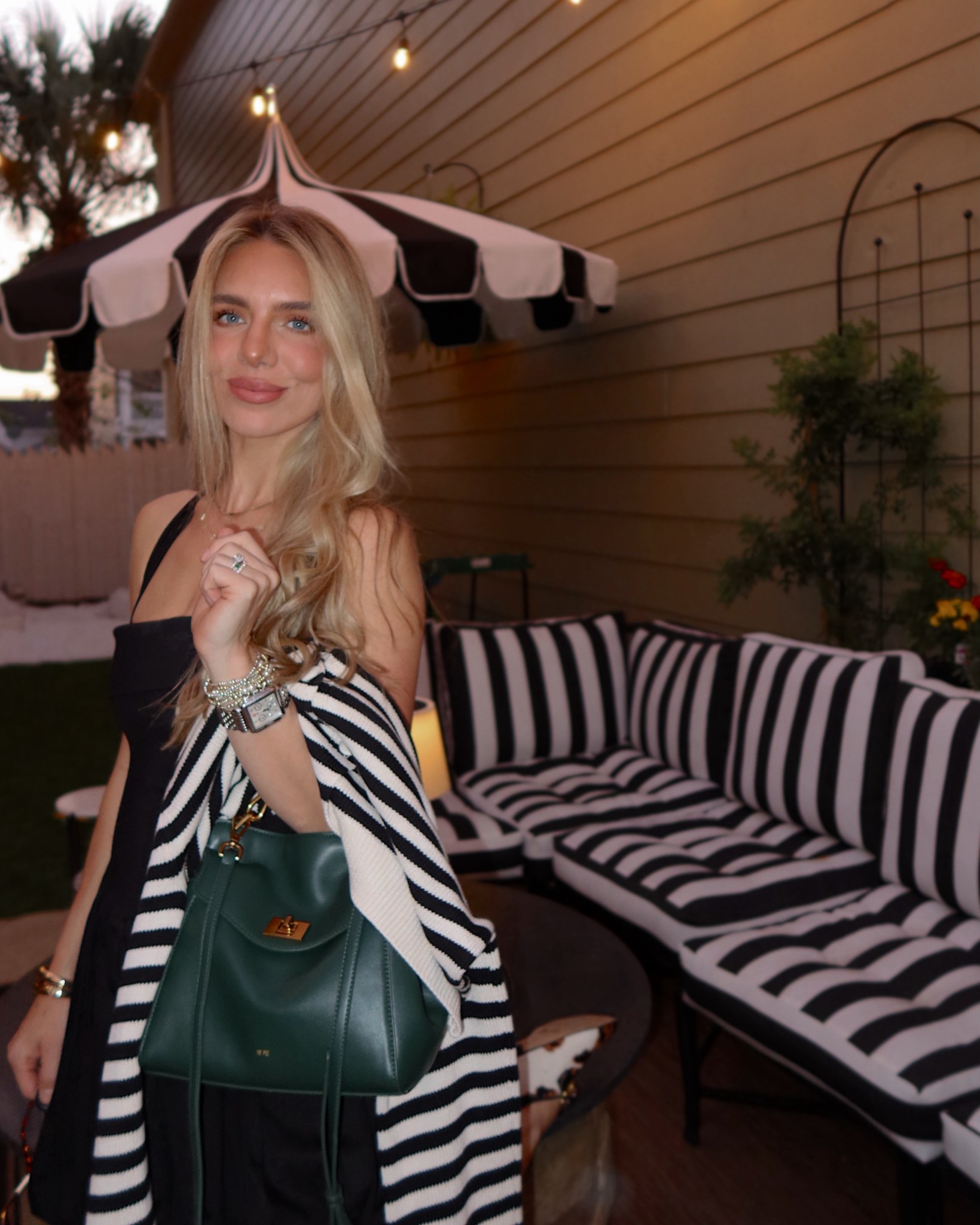 Black and white stripes and green accents from my home to my clothes! Green fall bag, black and white stripe sweater cardigan, and black and white stripe outdoor cushions and umbrella 🖤🤍💚

#LTKItBag #LTKFallSale #LTKHome