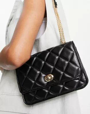 ASOS DESIGN diamond quilted crossbody with lock detail and adjustable shoulder strap in black | ASOS (Global)