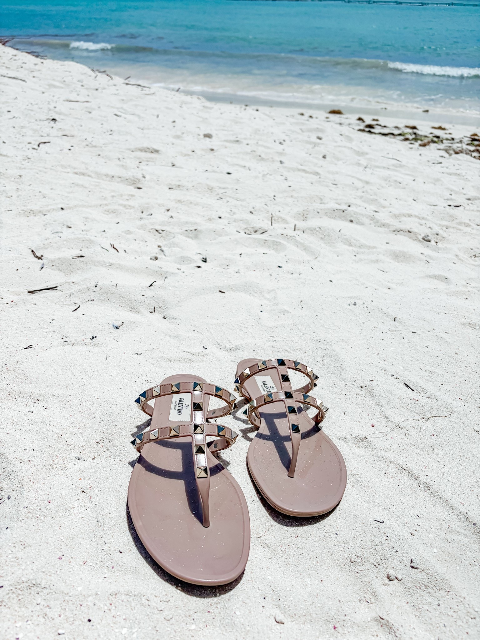 These Valentino Rockstud jelly sandals are 5 years old and my go to vacation shoes.  They rinse off so easily.  Grab them preowned to save $$.  I am normally a size 6.5 and grabbed these in a 37.  I also linked dupes for a fraction of the cost!

#ltkdesigner #ltkshoecrush