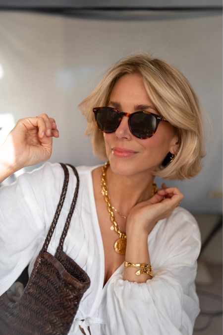 Sunglasses 
Gold pendant necklace 
Gold jewellery 
Woven leather basket bag 

#LTKuk #LTKeurope #LTKstyletip