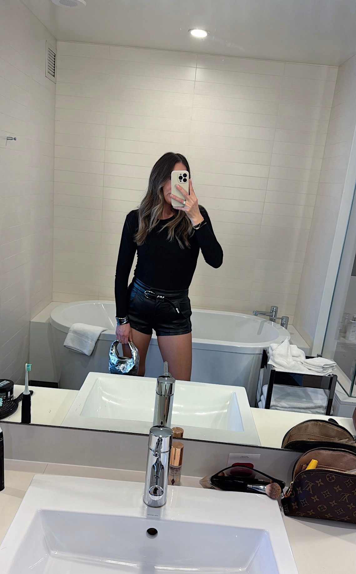 One Night in Vegas 

#leathershorts
#hotshorts
#allblack
#belt
#silverclutch
#silverbangle
#tights
#boots
#kneehighboots

#LTKStyleTip #LTKShoeCrush #LTKFestival