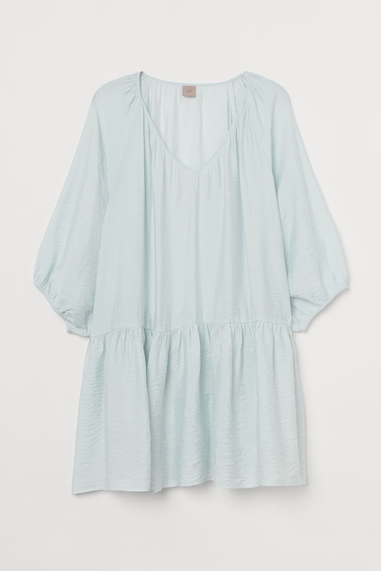 Short, A-line dress in a woven viscose blend. Low-cut V-neck, wide, 3/4-length raglan sleeves, an... | H&M (US + CA)